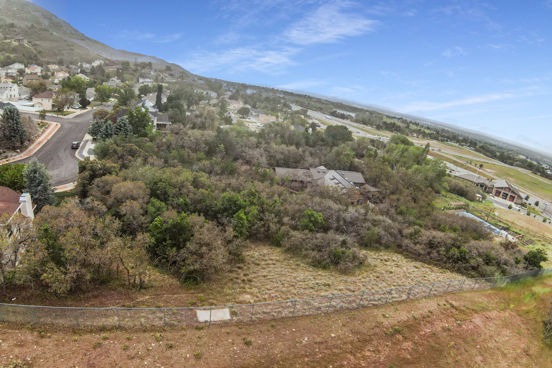 Expansive wooded hillside lot offering privacy and natural surroundings