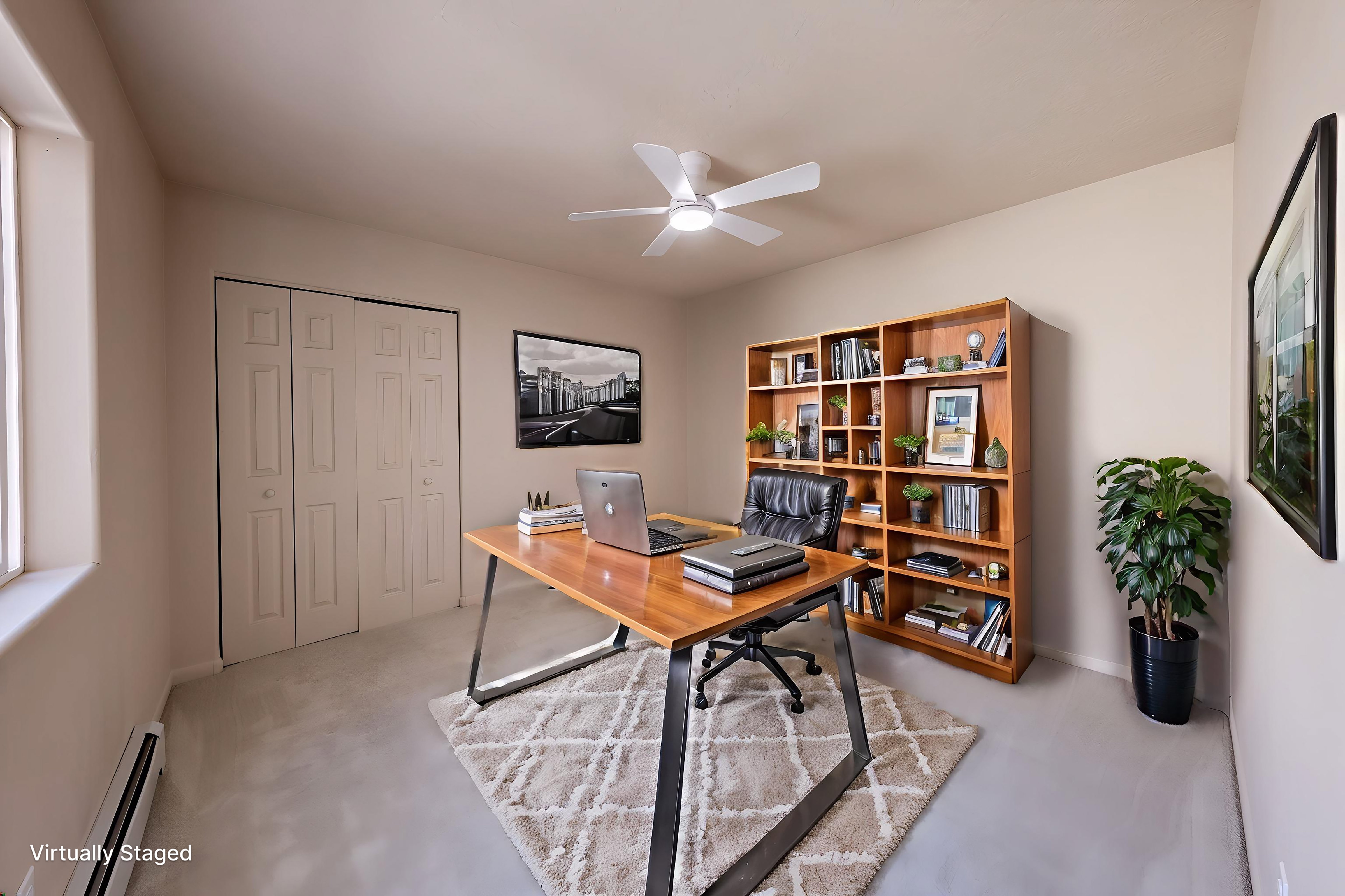 Carpeted room featuring a ceiling fan with light, baseboard heating, a window, and bifold closet doors