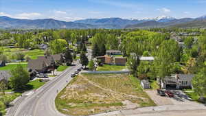 Expansive lot featuring a wide street frontage and a mountain backdrop