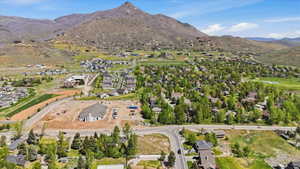 Expansive elevated property with established residential areas and undeveloped land parcels
