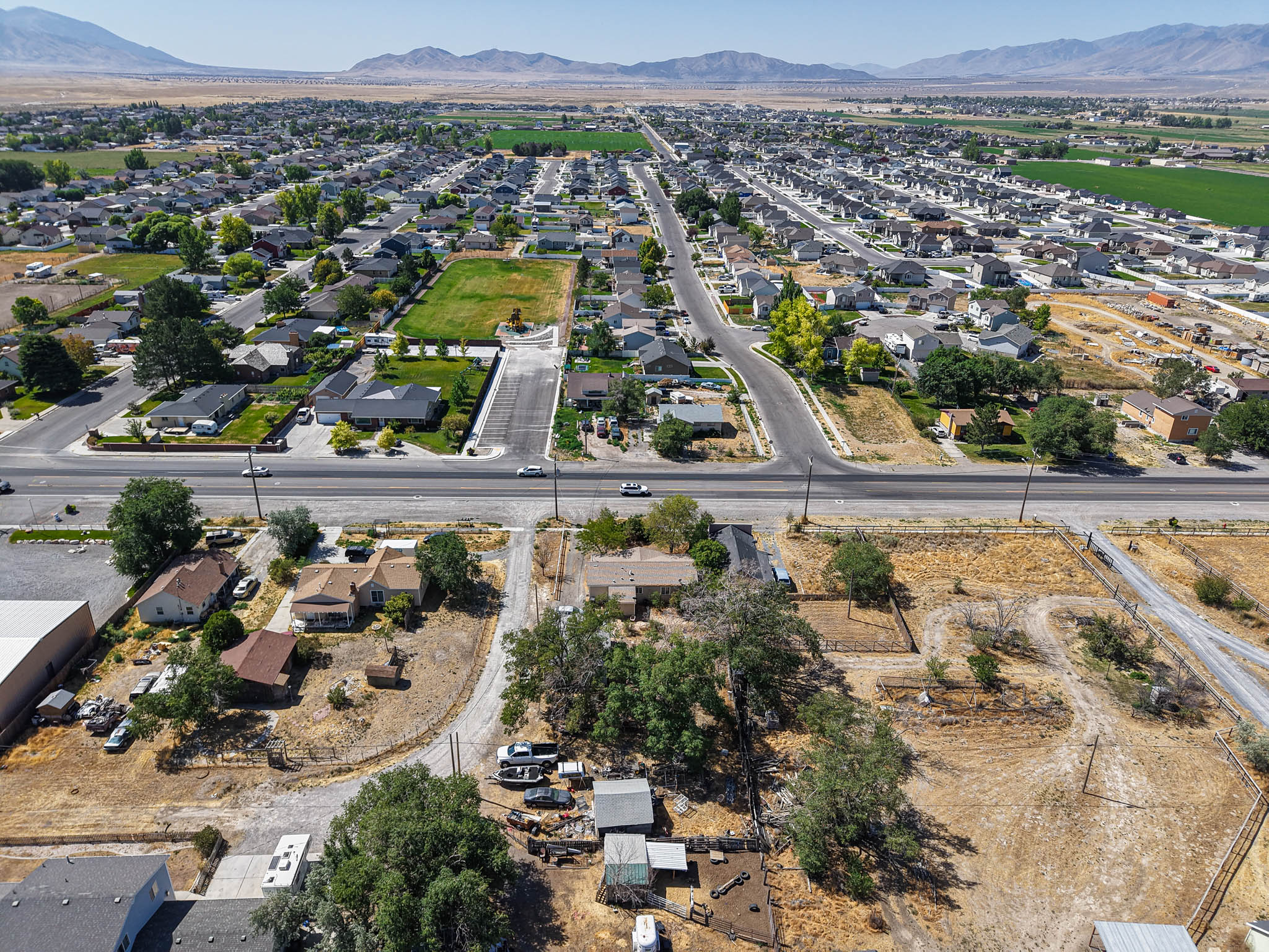 Aerial perspective showcasing a residential neighborhood with distant mountains