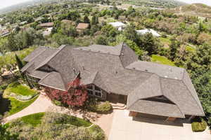 Property exterior featuring a multi-gabled roofline and a concrete driveway