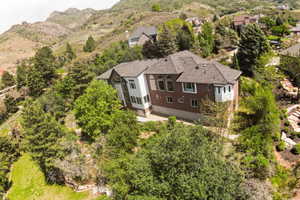 Hillside residence featuring a multi-level design and expansive landscaping