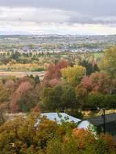 Expansive landscape with a distant city skyline and mountain range