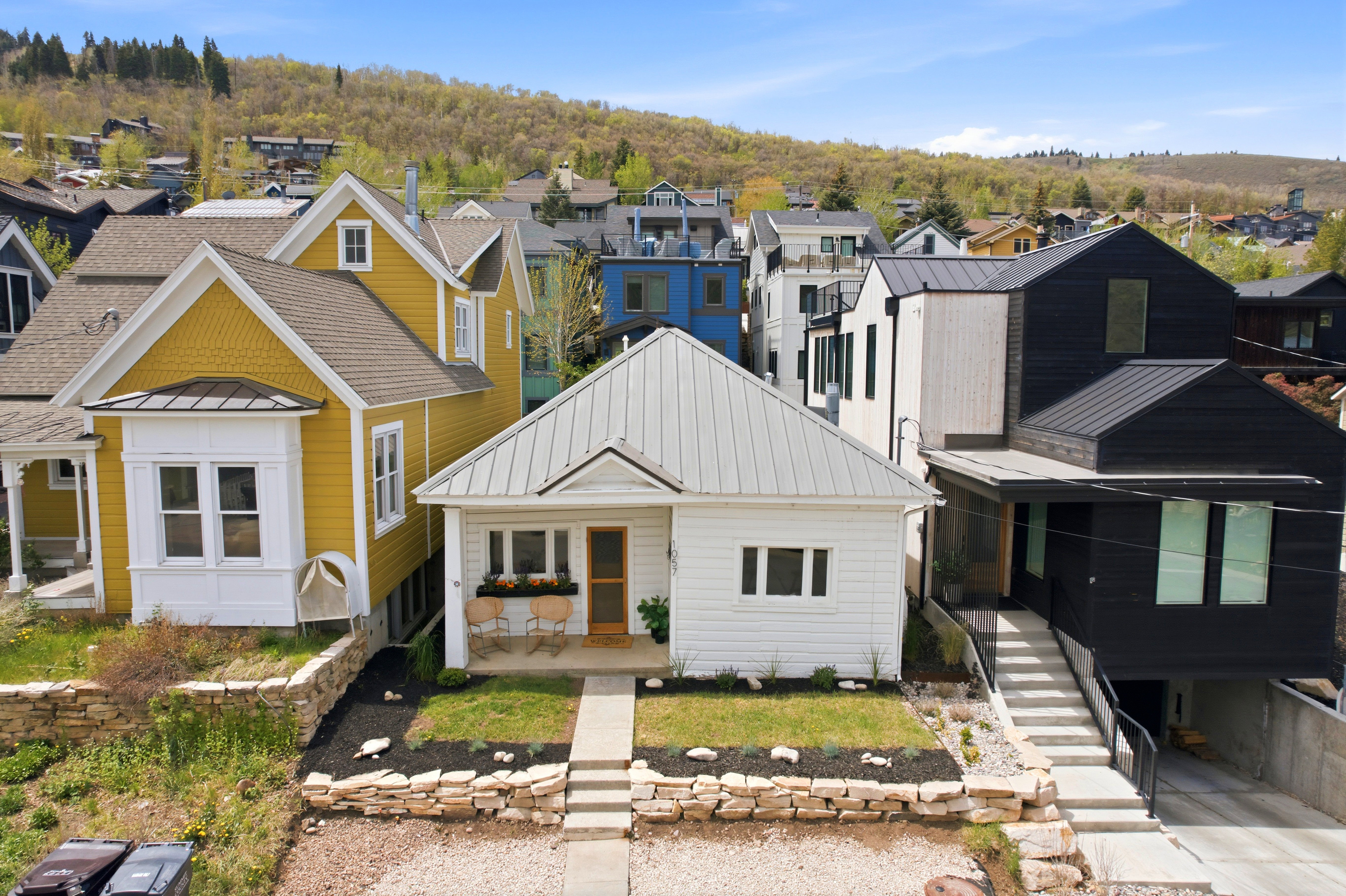 White exterior with a light gray metal roof