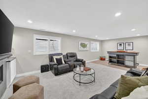 Spacious recreational area featuring recessed lighting and neutral wall tones