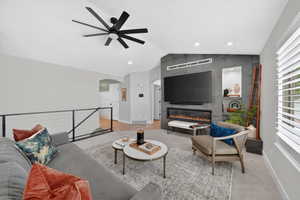 Living space featuring a modern ceiling fan, recessed lighting, and a cable railing system