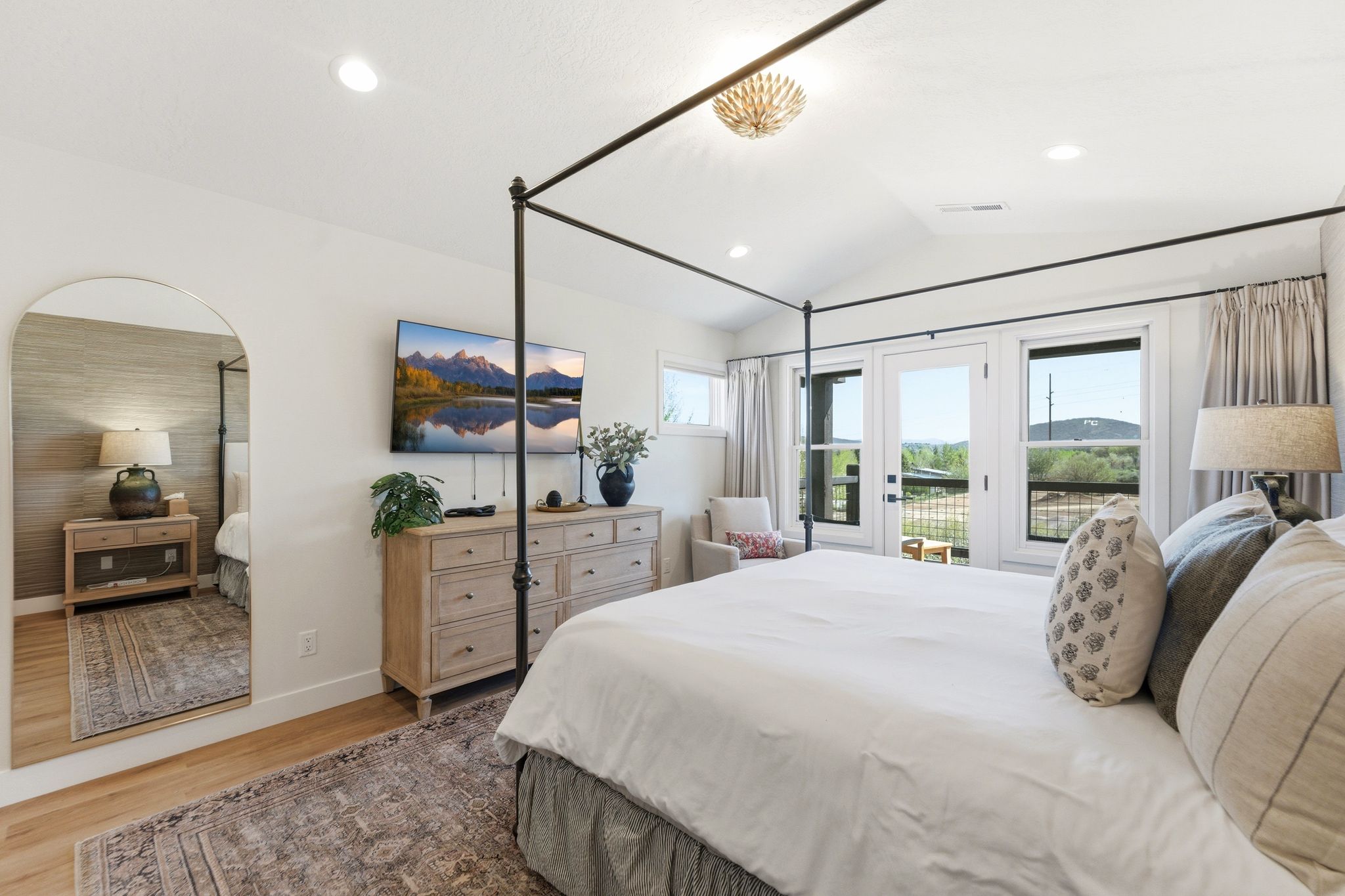 Vaulted ceiling room with recessed lighting and a decorative chandelier