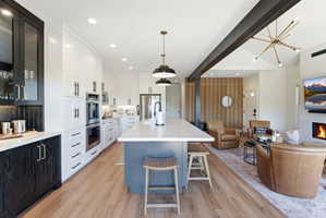Open-concept living space featuring wood-finish flooring throughout