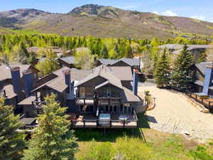 Multi-level property with dark-toned siding and multiple outdoor decks