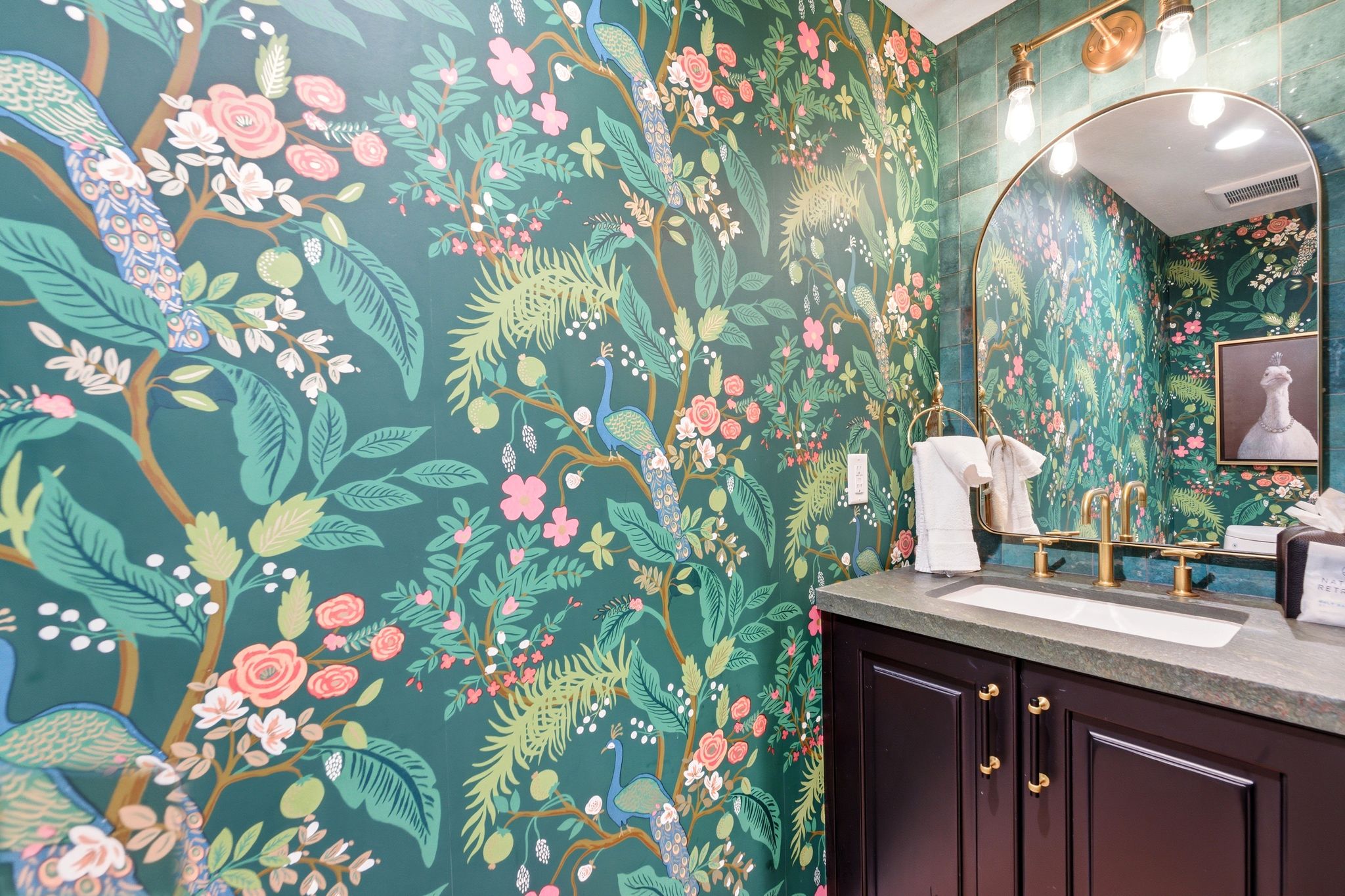 Vibrant botanical wallpaper with peacock accents