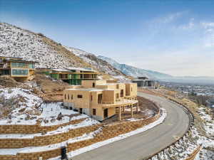 Modern architectural structure under construction, featuring multiple levels and an expansive outdoor deck