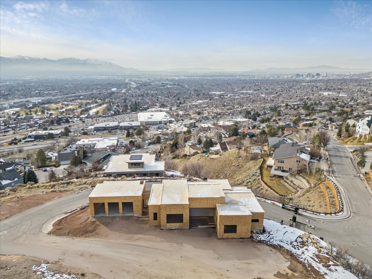 Property under construction featuring a multi-car garage, contemporary architectural design, and a flat roofline