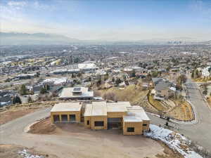 Property under construction featuring a multi-car garage, contemporary architectural design, and a flat roofline