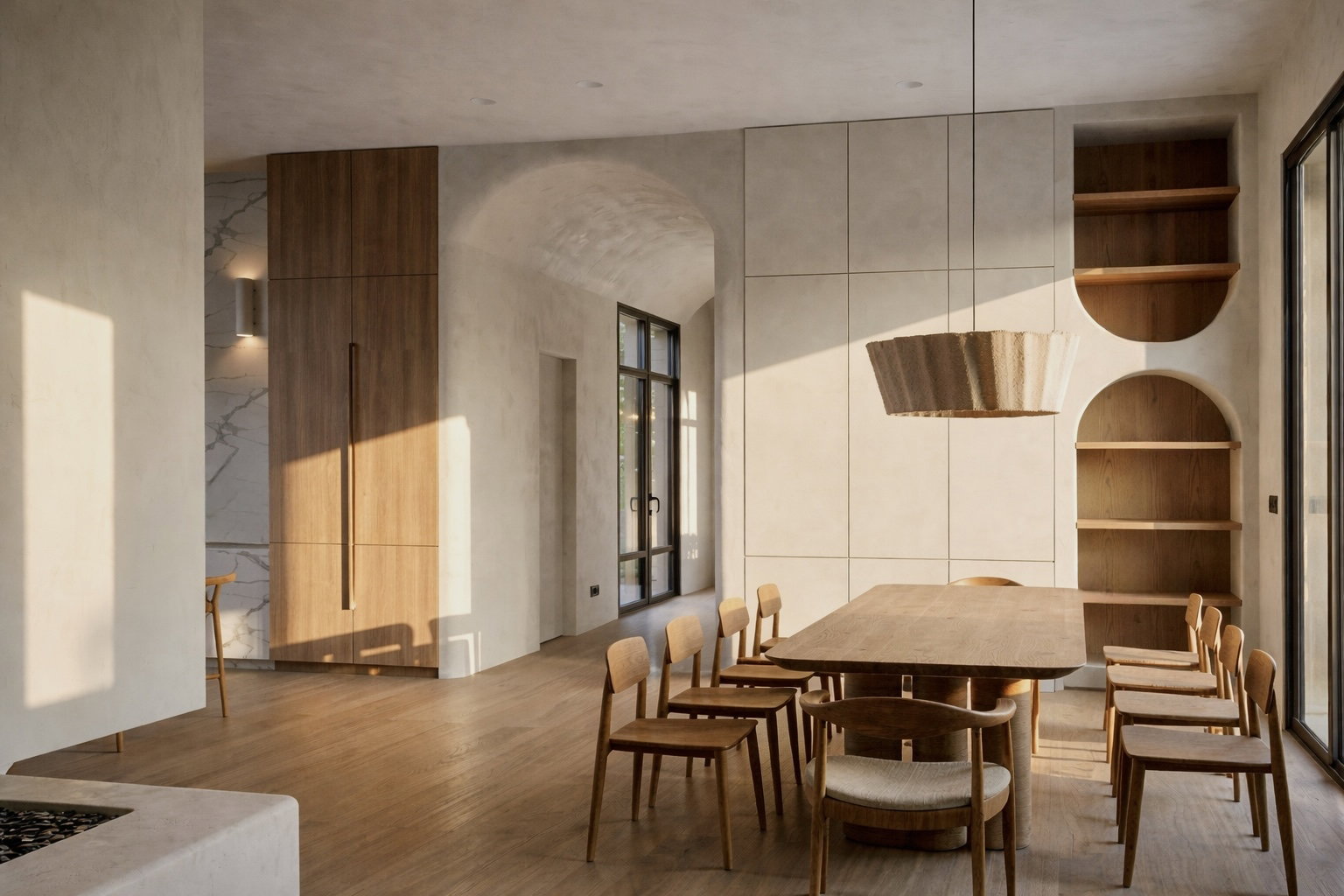Open concept interior featuring light wood-finish flooring, a wall of built-in cabinetry, integrated arched shelving, a large dining table, and dark-framed windows