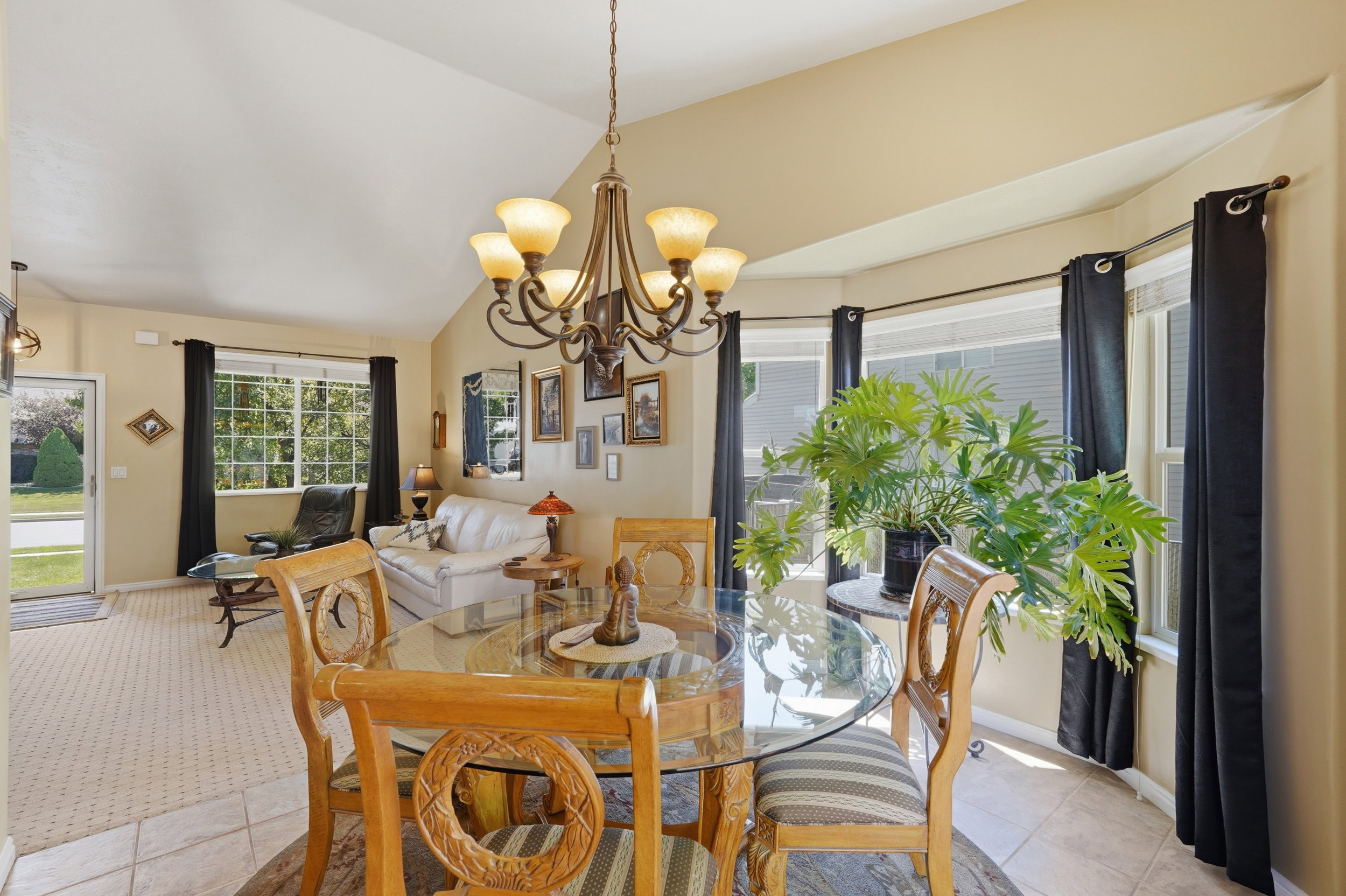 Dining area featuring decorative chandelier and  bay window