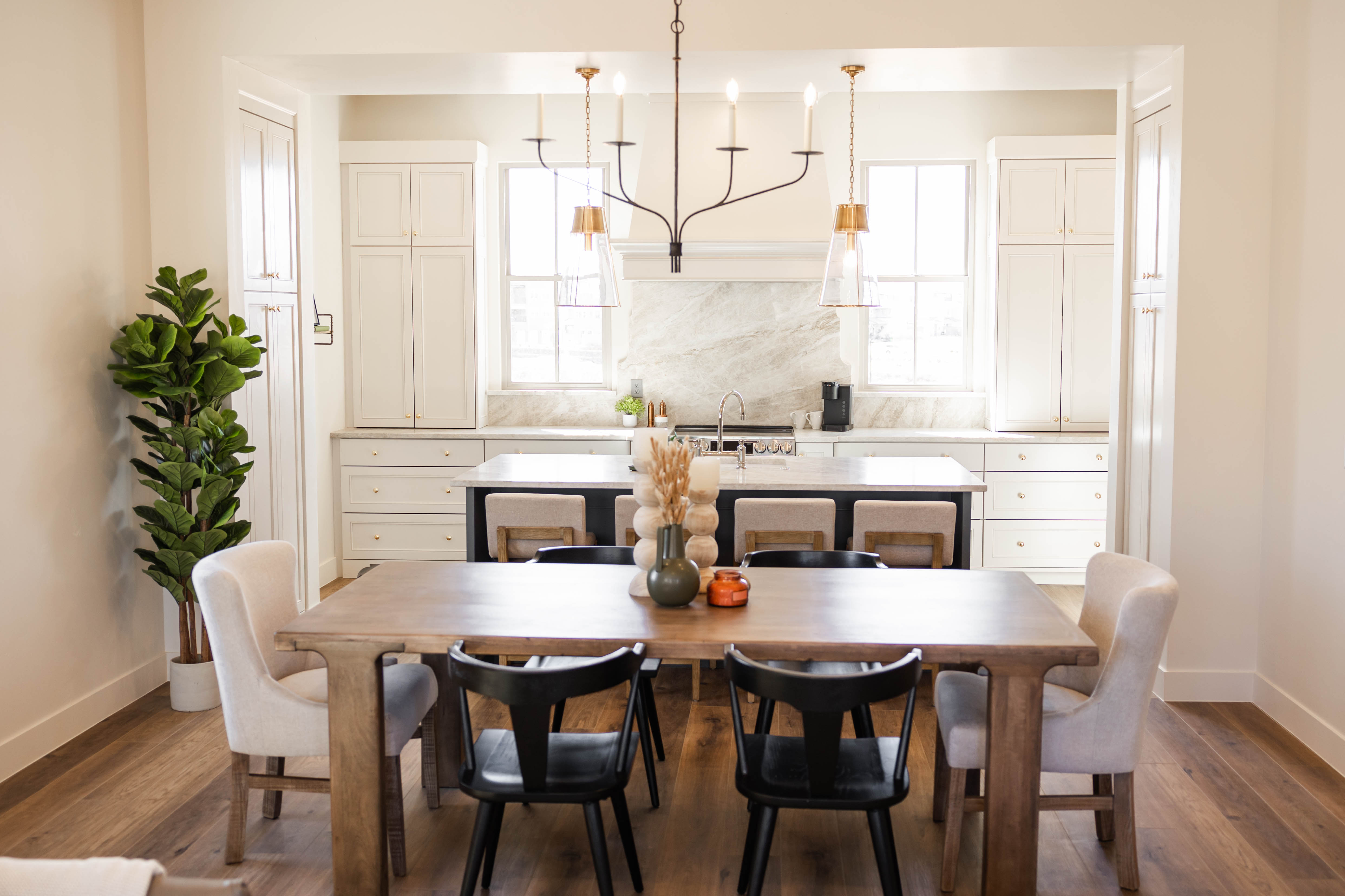 Open-concept dining area with wood-finish flooring
