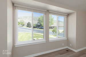 Dual windows featuring white framing and blinds