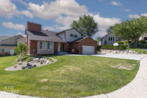 Brick and siding exterior with a dark shingle roof