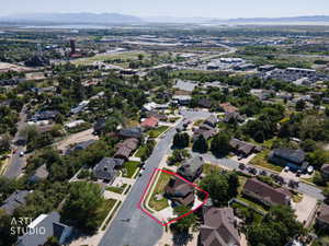 Residential neighborhood setting featuring mature trees and established homes