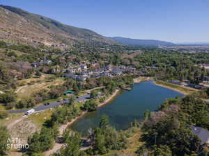 Aerial perspective showcasing a mountain-lined landscape with a prominent lake