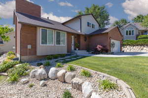 Brick and siding exterior with an attached garage