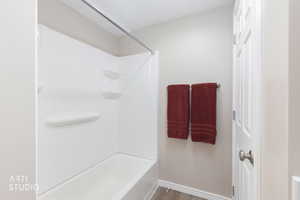 Tub and shower combination featuring integrated shelving