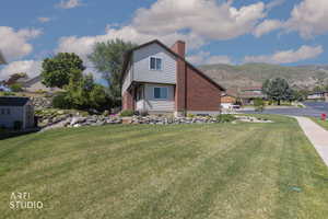 Two-story residence featuring a brick and siding exterior