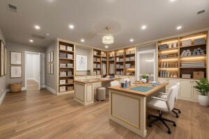 Spacious room featuring extensive built-in shelving, recessed ceiling lighting, and wood-finish flooring