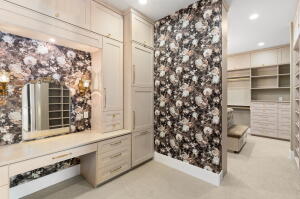 Built-in vanity with mirror and sconce lighting