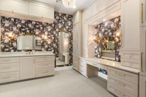 Integrated cabinetry featuring extensive storage and a dedicated vanity area