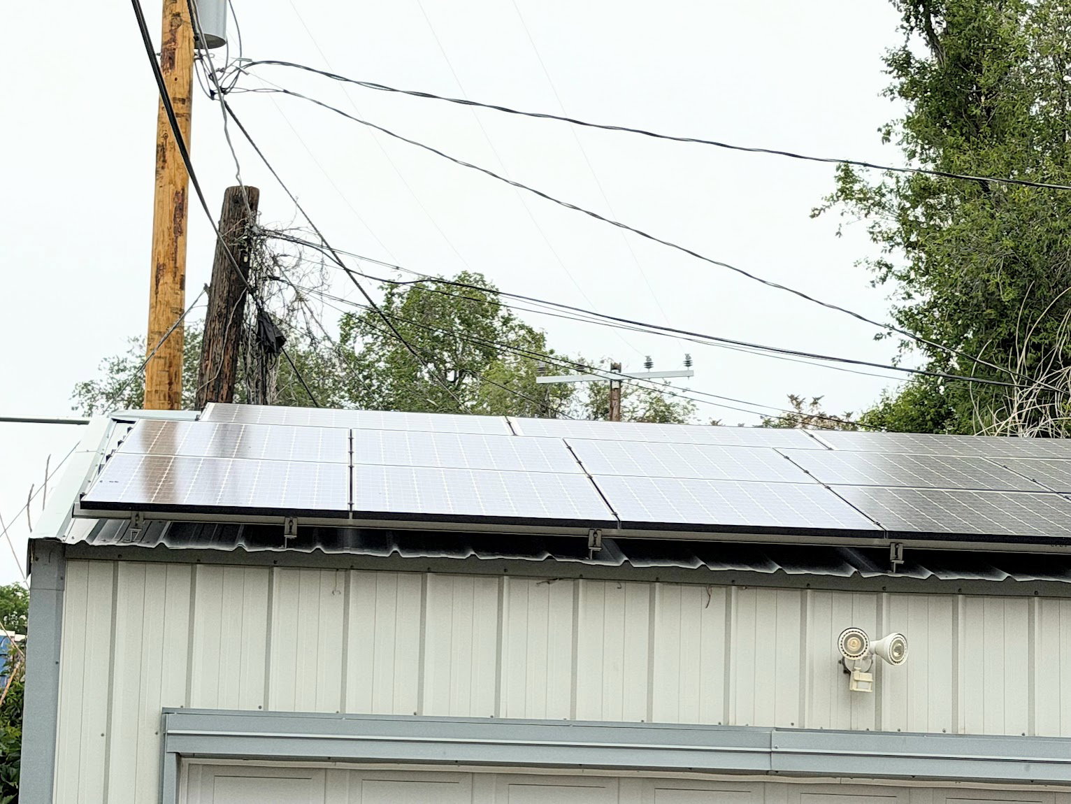 Building with a metal roof and integrated solar panel array