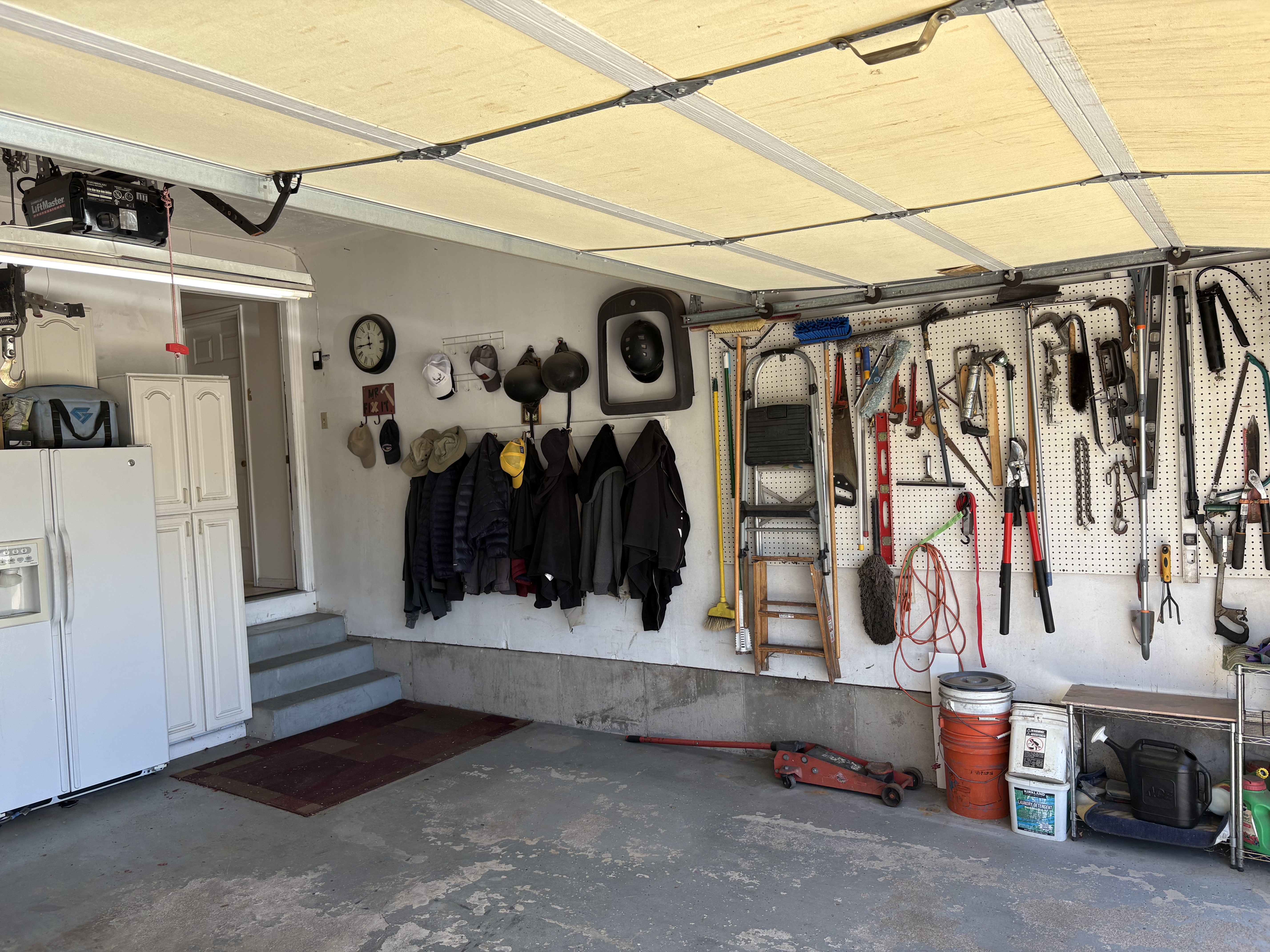 Attached garage featuring a concrete floor and a paneled overhead door