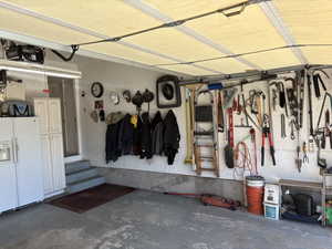 Attached garage featuring a concrete floor and a paneled overhead door
