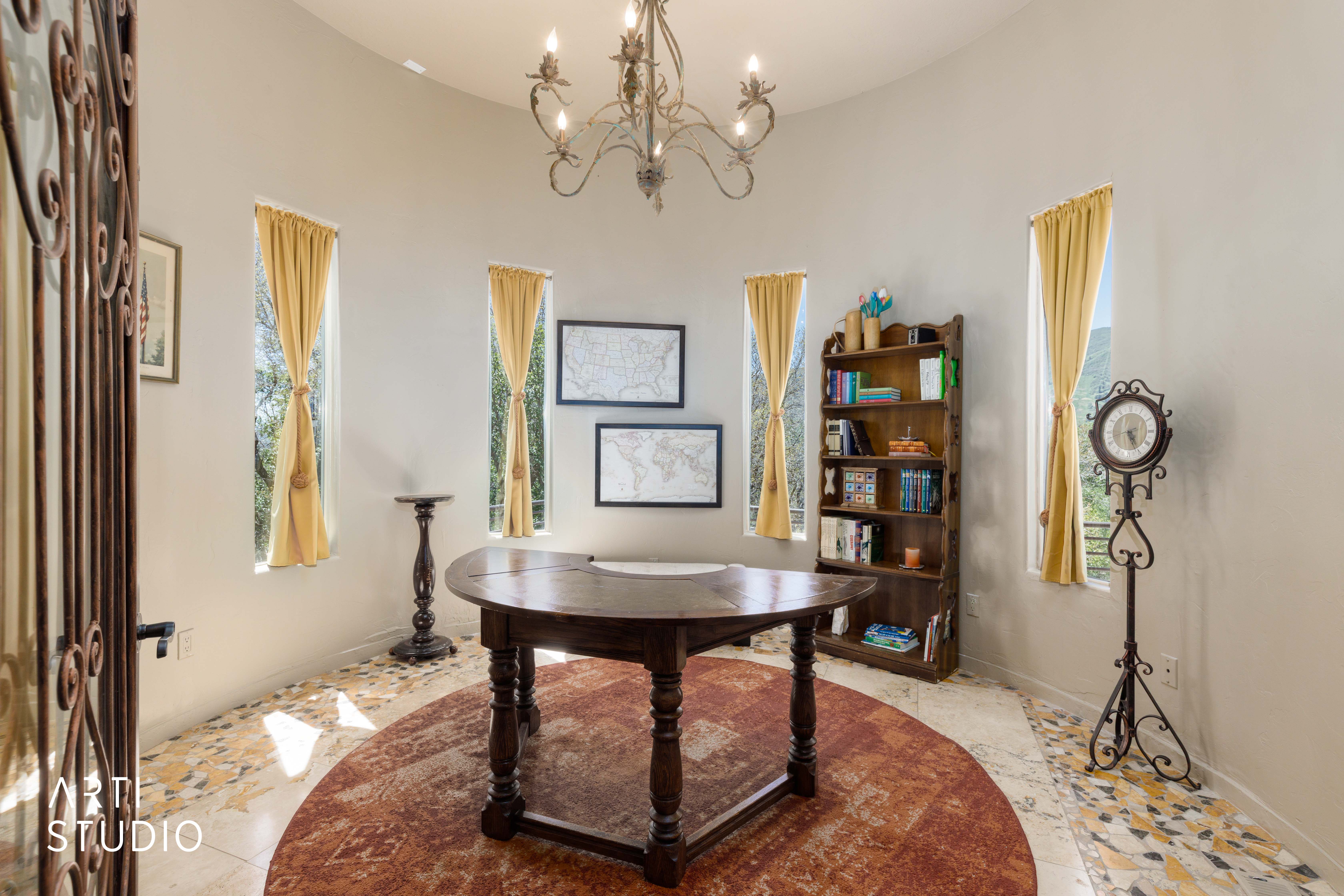 Rotunda space featuring a chandelier and five tall arched windows