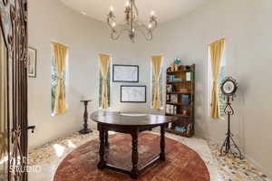 Rotunda space featuring a chandelier and five tall arched windows