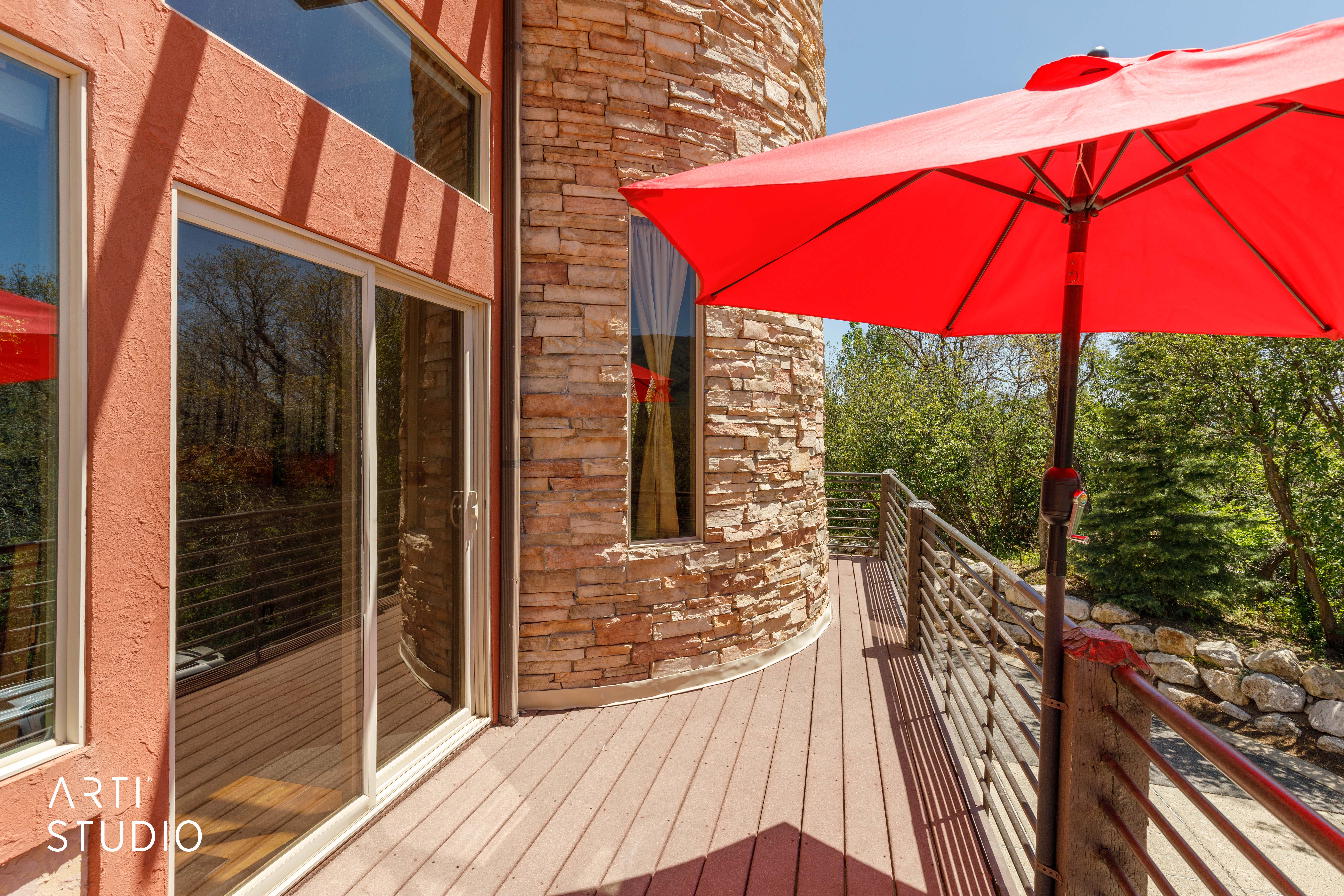 Exterior deck with wood-finish flooring and modern metal railings
