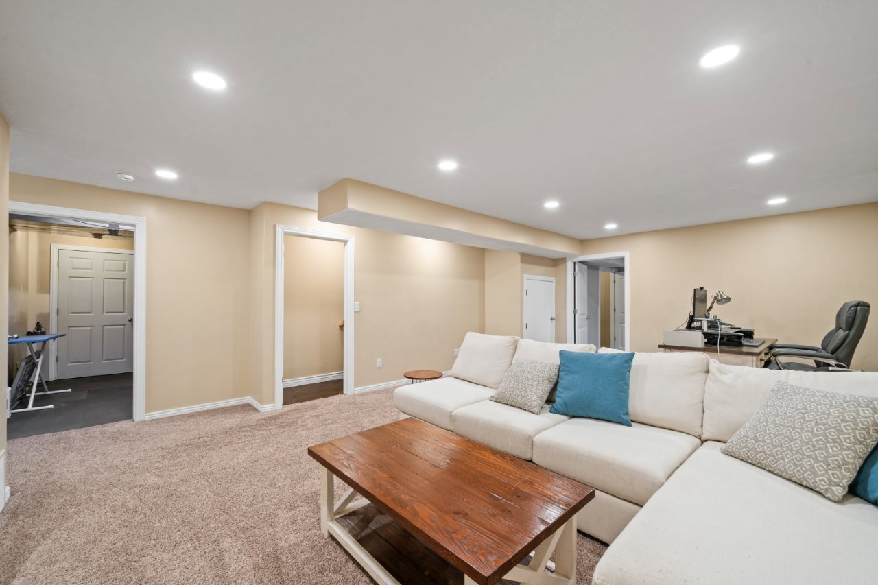 Spacious lower level featuring recessed lighting, neutral paint, and light brown carpeting