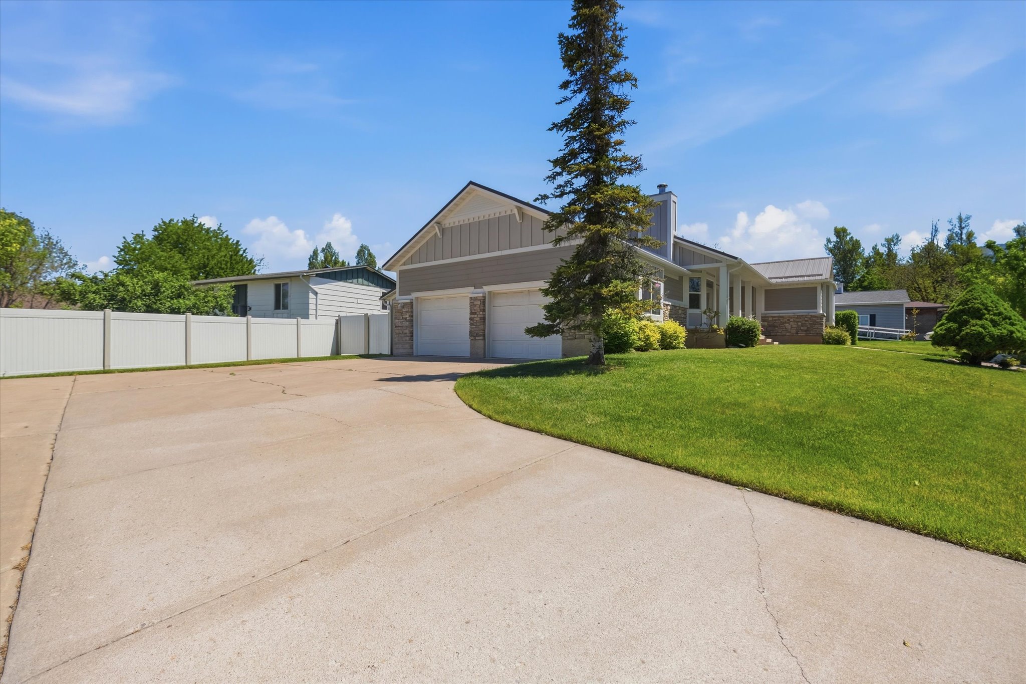 Concrete driveway leading to an attached two-car garage