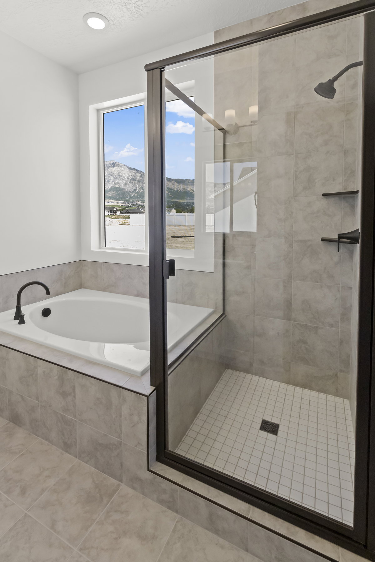 Primary Suite Bathroom w/ separate tub & shower.