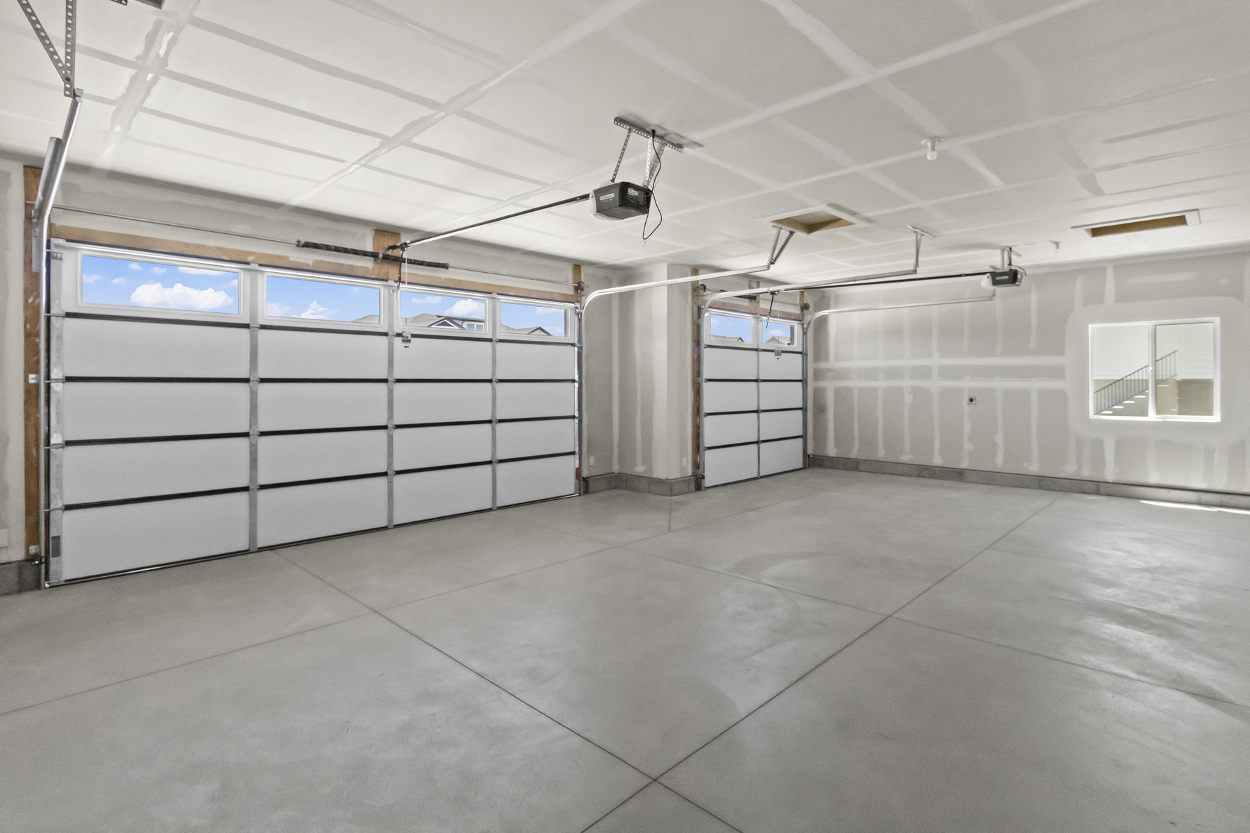 3 Car garage w/ natural lighting