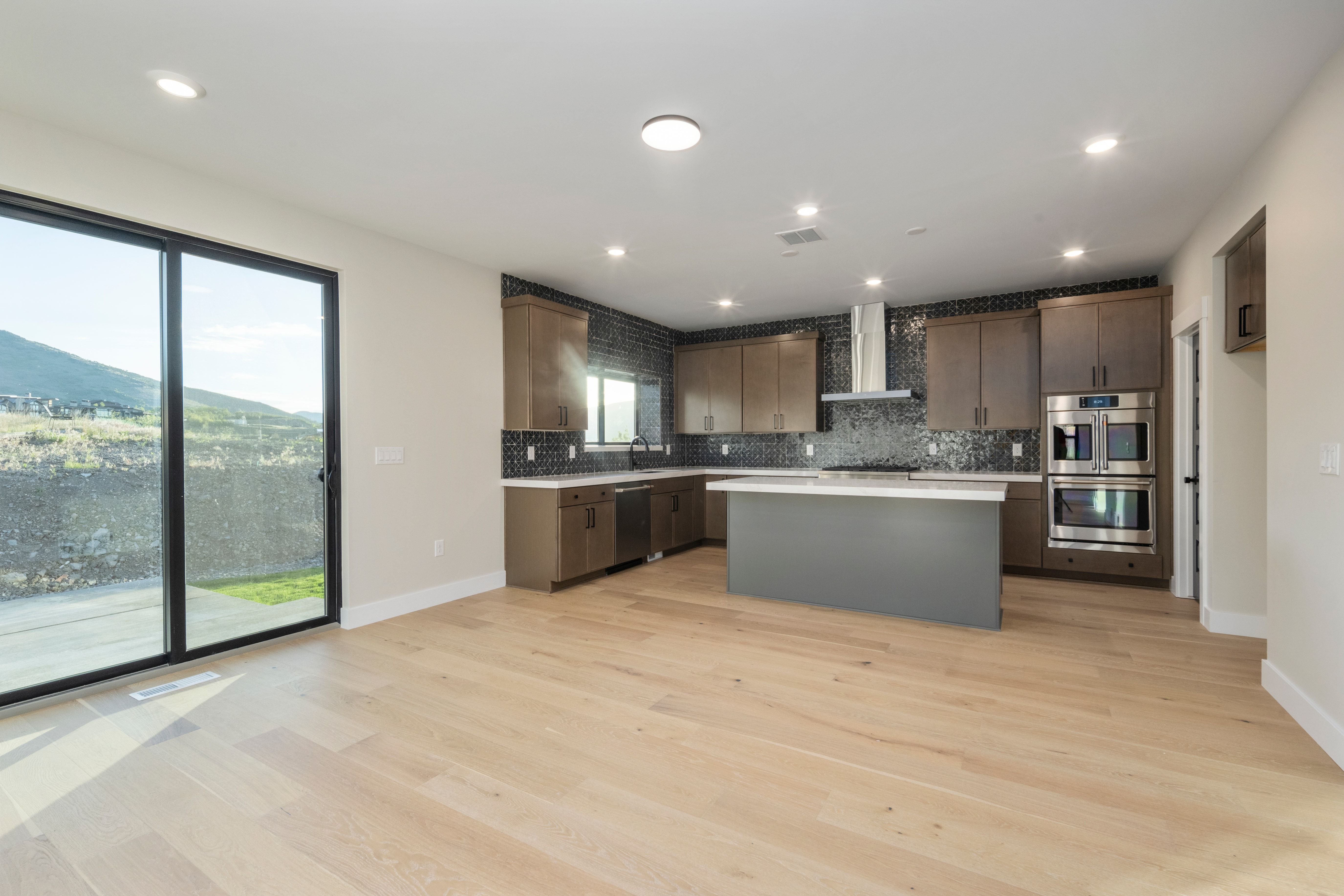 Open concept living area featuring light wood-finish flooring