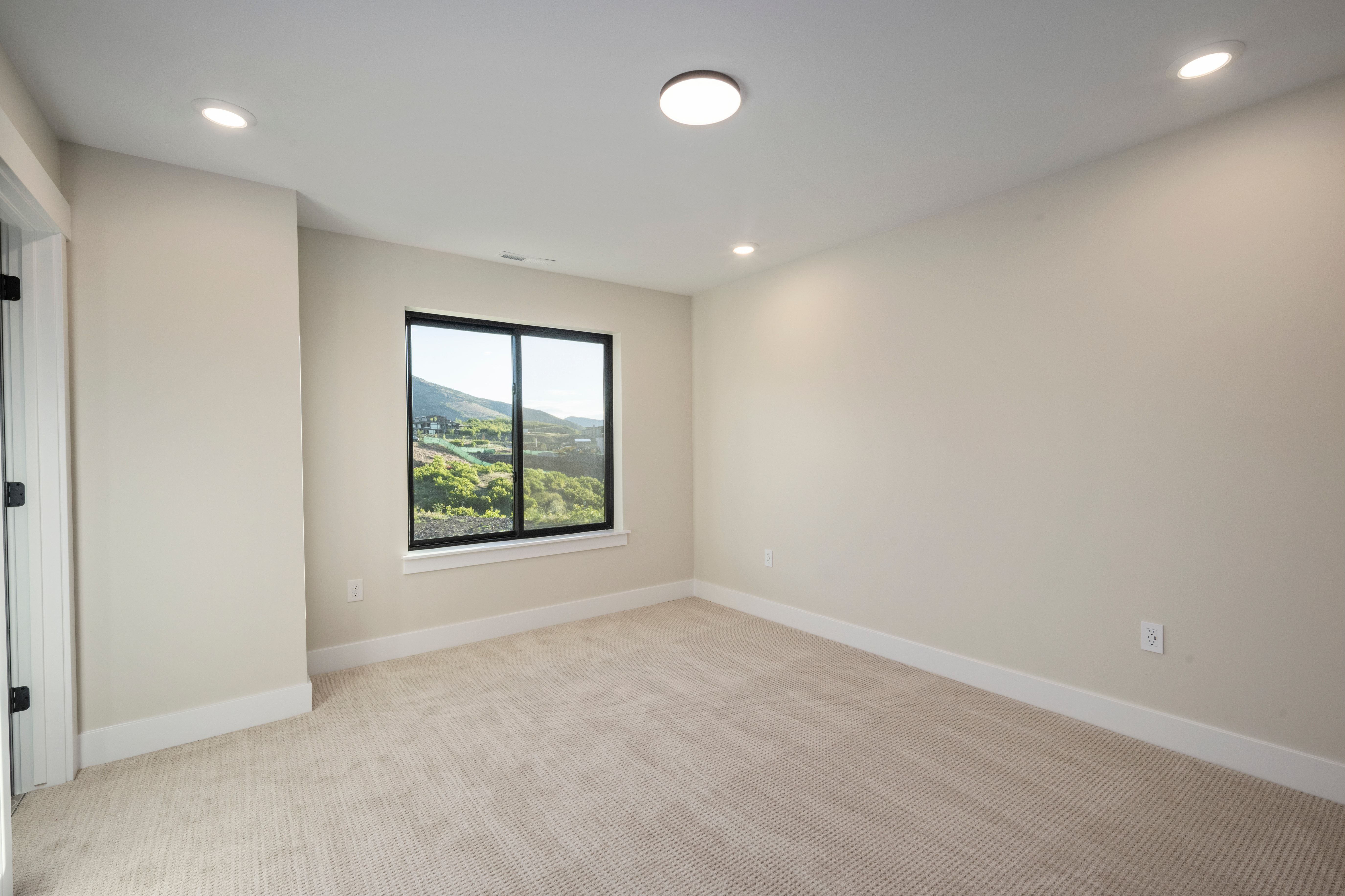 Neutral-toned carpeting paired with light walls