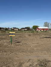 Cleared land lot, designated as Lot #13, featuring a level surface