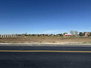 Expansive cleared lot with visible street frontage