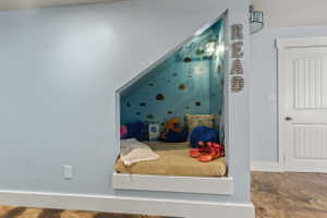 Built-in wall niche featuring interior lighting and decorative wall coverings