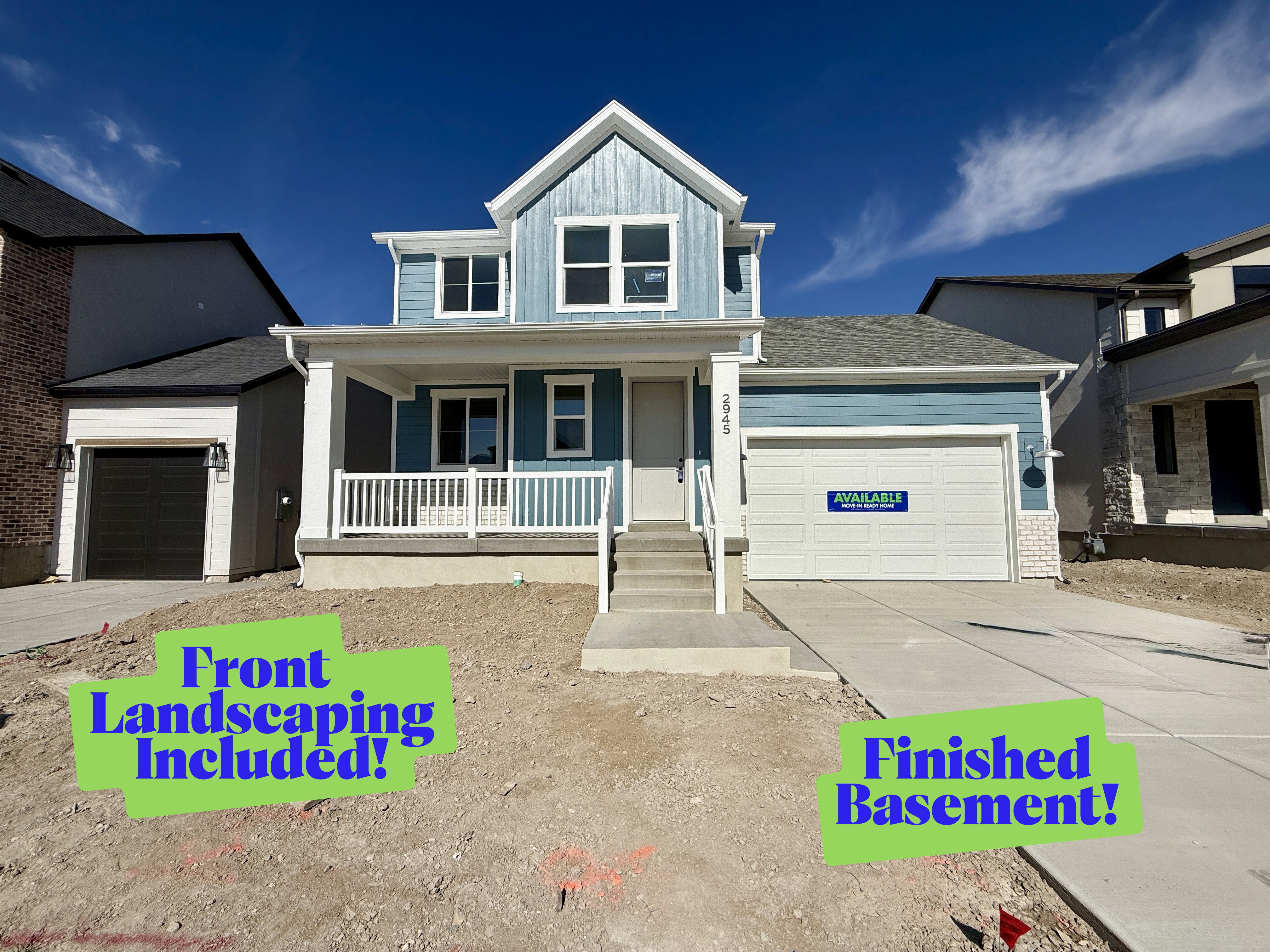 Contemporary two-story residence featuring a blue siding exterior with white trim accents and a covered front porch with white railings