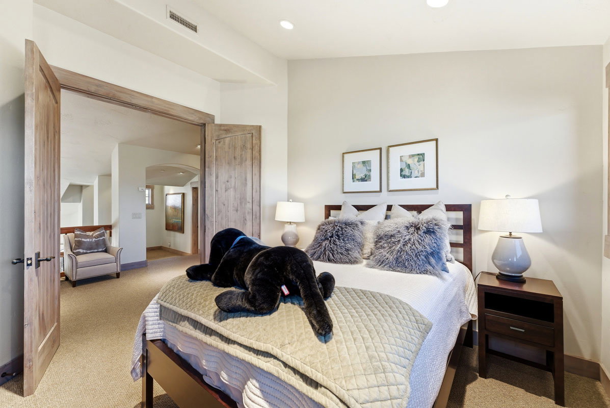 Bedroom featuring carpet flooring, recessed lighting, and a wood-frame bed