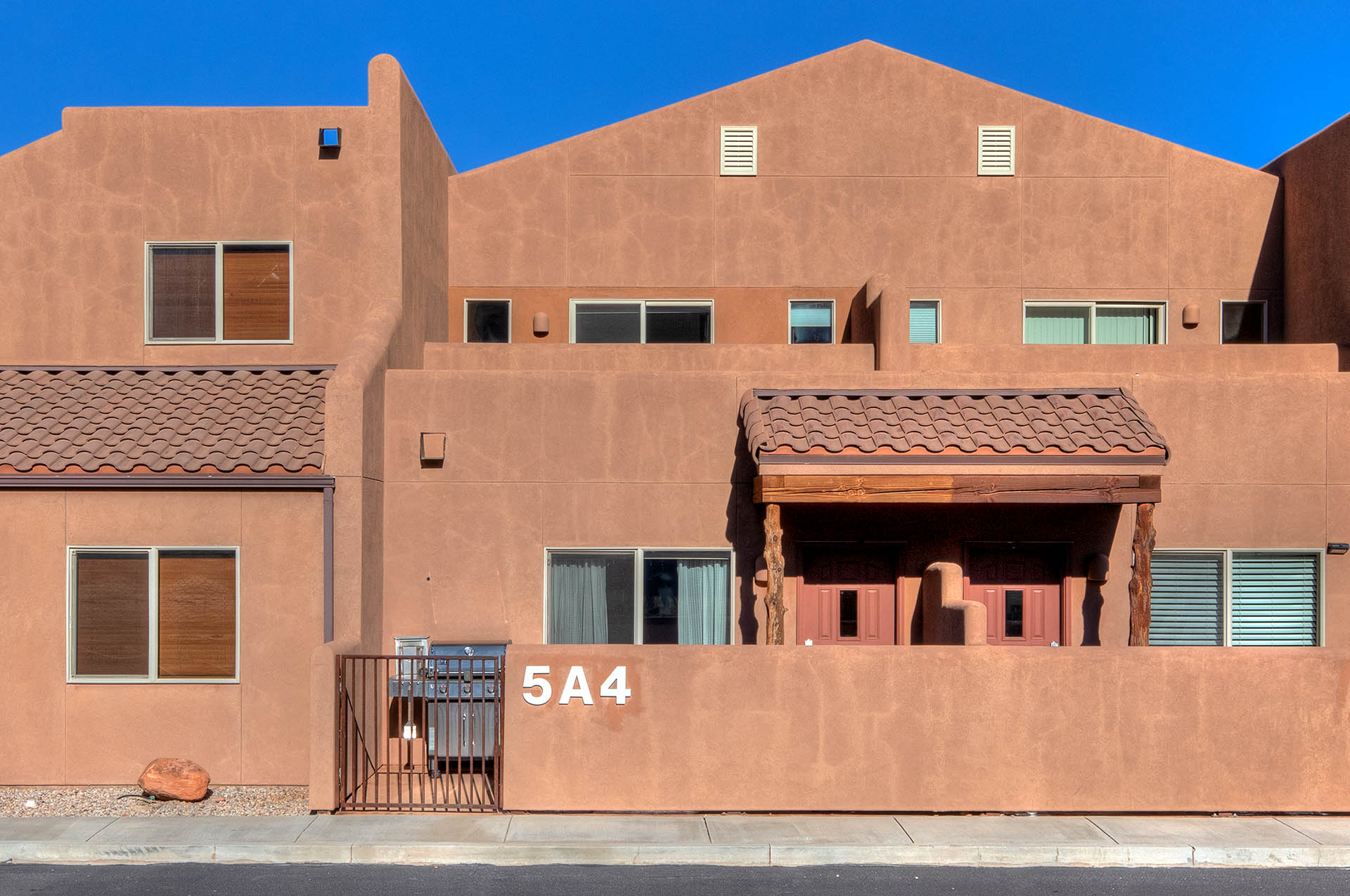 Southwestern-style stucco exterior featuring a tiered architectural design