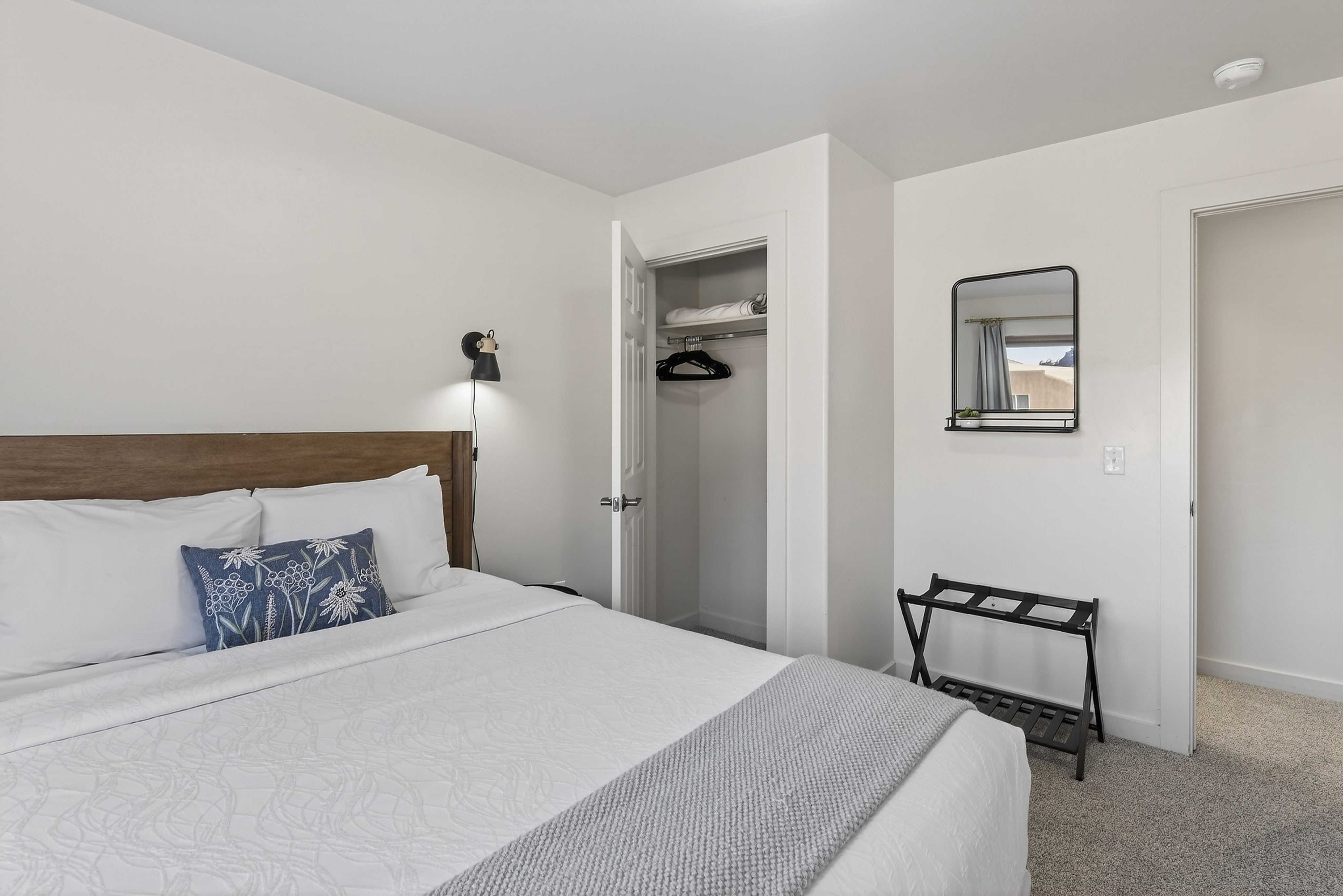 Bedroom featuring light gray carpet flooring and white painted walls